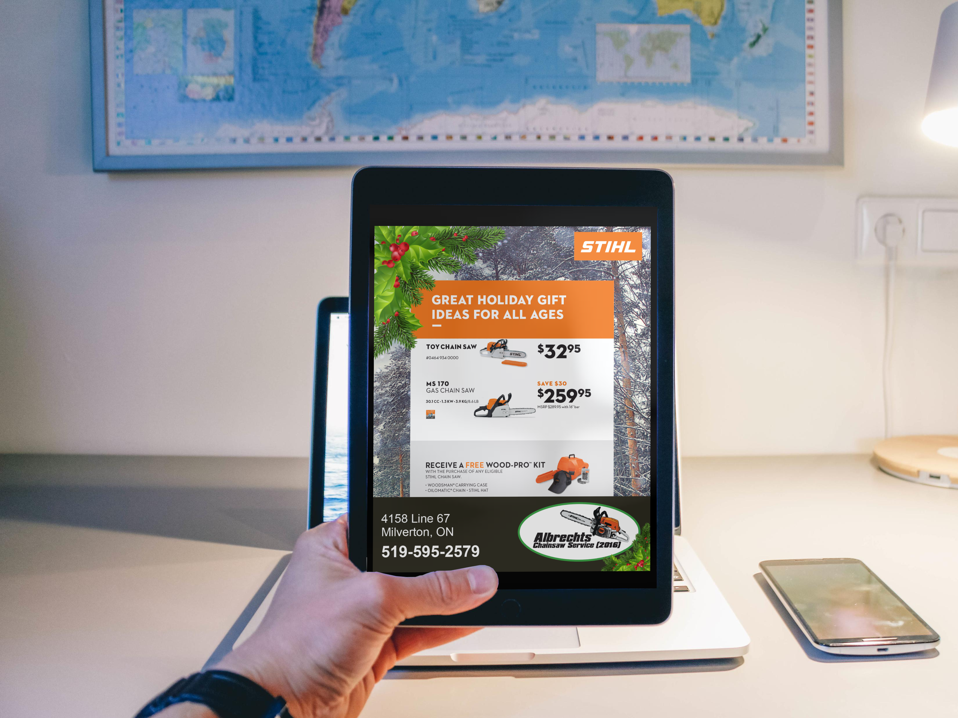 Albrechets Chainsaw Ad on an ipad with a persons hand holding it